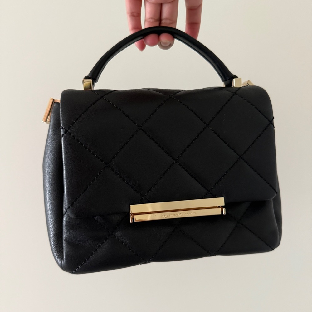 Black Quilted Handbag with Gold Accents